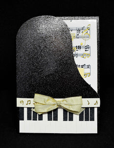 Carte d'anniversaire forme piano noir au noeud doré