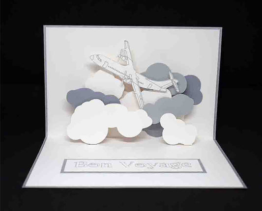 Carte blanche et grise en pop up pour un départ "bon voyage" motif avion et nuage