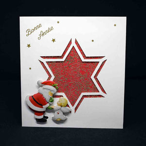 Carte de voeux Noël en 3D découpe étoilée rouge motif 3D père noel et ange