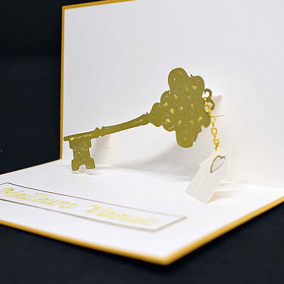 Carte de voeux en pop up, clé dorée
