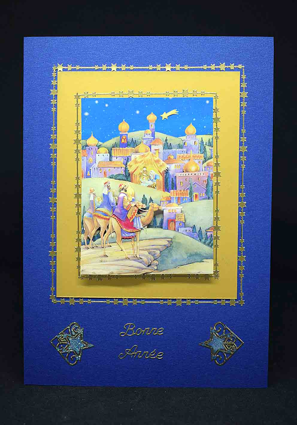 Carte de Noël bleue et dorée au motif en 3D rois mages