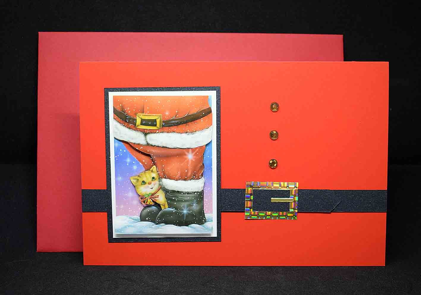 Carte de Noël en 3D sur papier rouge au motif ceinture du père noel